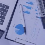 Image by mindandi on freepik - business-concept-with-copy-space-office-desk-table-with-pen-focus-analysis-chart-computer-notebook-cup-coffee-desk-vintage-tone-retro-filter-selective-focus